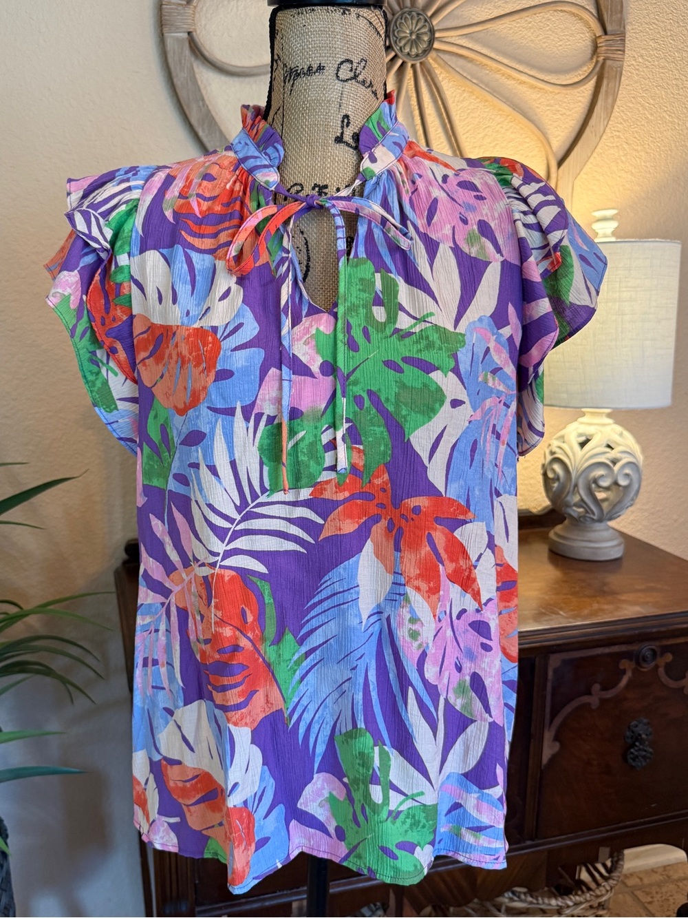 Easel Women’s Purple Tropical Print Flutter Sleeve Tie-Neck Blouse